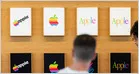 Apple overtakes Nvidia to become the world's most valuable publicly traded company, two years after it lost the crown, closing at a $4.9T market cap on Monday (Kalley Huang/New York Times)