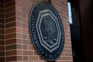 The US CFTC exempts "passive software" providers from broker registration if they never hold user assets, expanding crypto and prediction market online trading (Lydia Beyoud/Bloomberg)