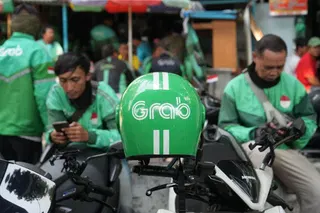 Grab agrees to acquire a 60% stake in Singapore-based BNPL platform Atome from Advance Intelligence Group and others for $1.49B; Atome had $470M in 2025 revenue (Olivia Poh/Bloomberg)
