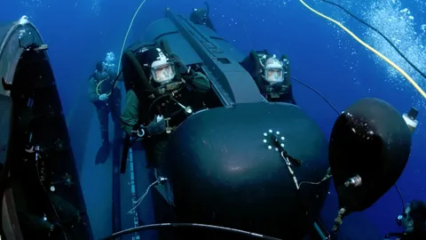 Navy SEALs In Mini-Submarines Teamed With Underwater Drones
