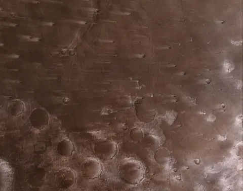 NASA’s Psyche Mission Spies Mars’ Wind-Blown Craters During Close Approach