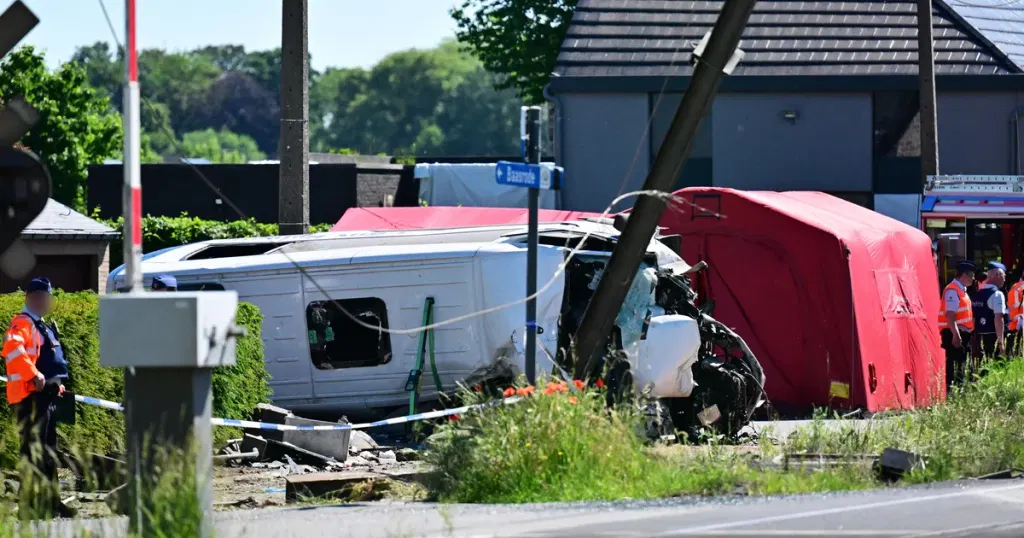 Train crashes into school minibus in Belgium