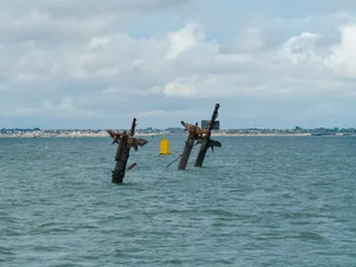 The SS Richard Montgomery's masts are coming down. The bombs are staying put