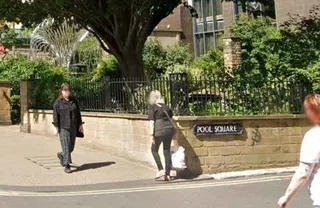 Pool Square street sign regularly painted over to read Poo Square