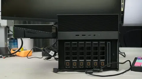  Humble NAS gets transformed into a gaming PC with and RTX 5060 hanging from its side — Frankenstein rig hides dedicated PSU in drive bay to achieve vast performance increase over iGPU 