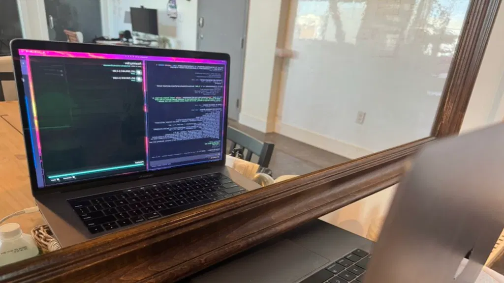 AI on Intel MacBook laptop uses webcam and mirror to rewrite and debug its own AMD Radeon driver code live and direct — without a programmer in the loop