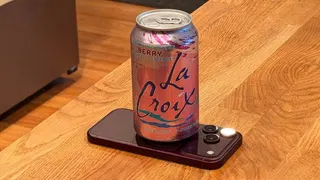  Enthusiast cooled iPhone 18 Pro with cold can of La Croix sparkling water; benchmarks show 25% higher sustained performance 