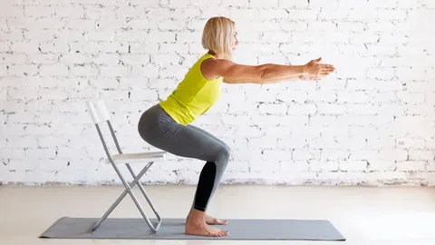  These are the 4 chair yoga stretches trainers recommend to ease stiff joints after 60 
