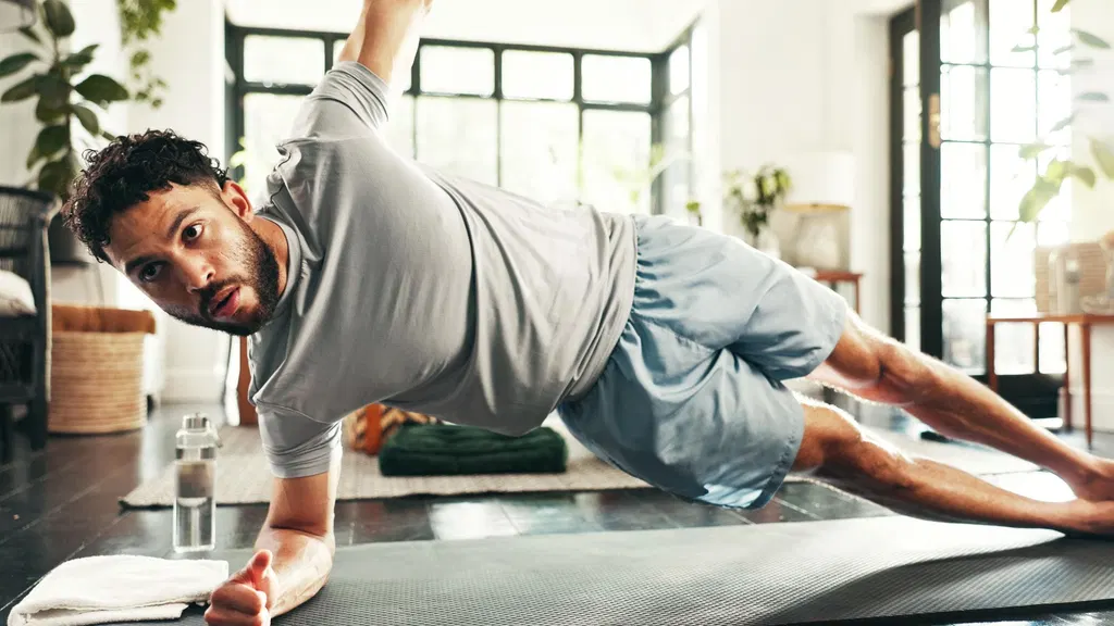 I’m a personal trainer over 40, and these are the 4 exercises I’m doing to preserve my balance