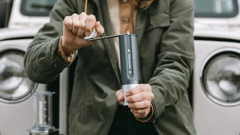 AeroPress just launched a stylish new manual coffee maker with titanium burrs that you can crank by hand — or with an electric drill