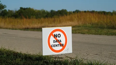 Teacher arrested for clapping in support of opposition at an AI data center meeting — gigawatt-scale project gets approved anyway despite community resistance