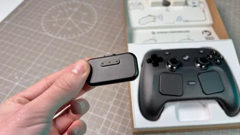 You need to know the Steam Controller's charging puck is always live, so if you accidentally touch it with something conductive, you're in for a shock