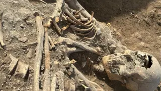 Archaeologists Unearth a Medieval Woman Buried With a Child in Her Arms