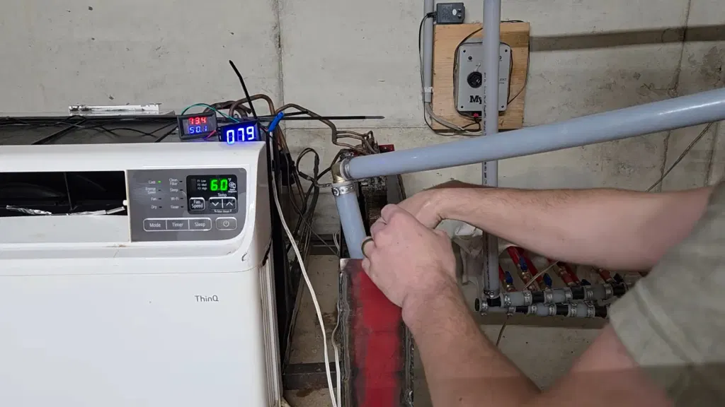 Dumpster-dived Window A/C becomes Ground-Source Heat Pump