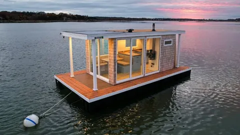 Friends become stars after turning rotting, $4,000 pontoon into a gorgeous, $140,000 houseboat complete with Hamptons-style shingle and blonde wood interior