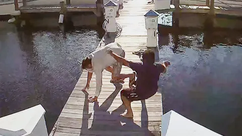 Chilling moment Florida man kills drinking buddy before casually dumping his body off a pier and kicking victim's shoes in behind him