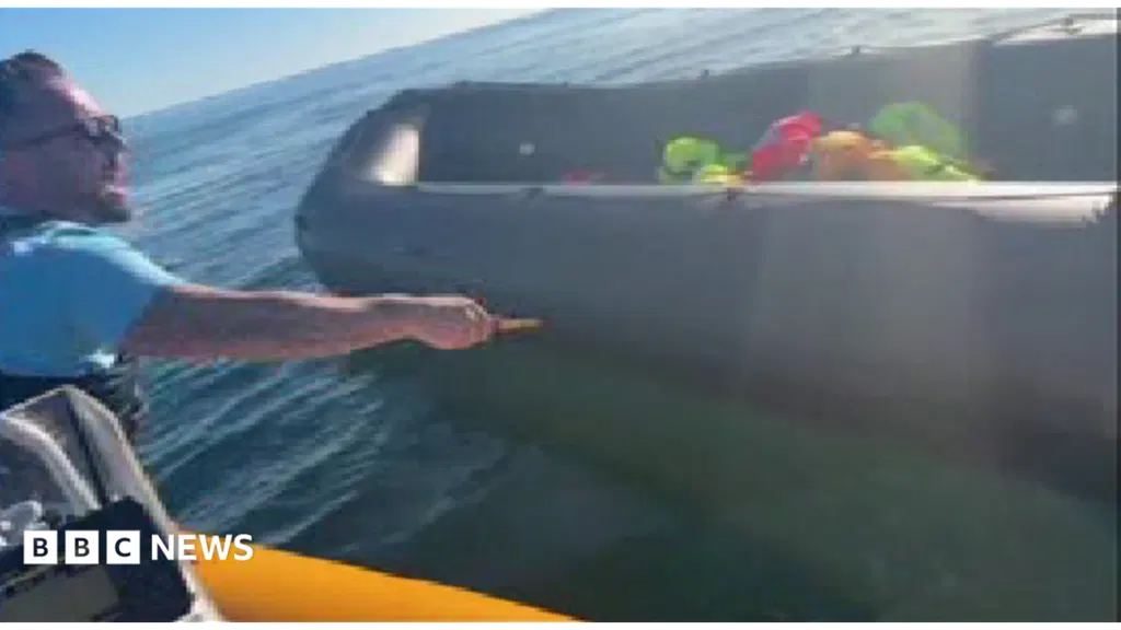 Police examining video of anti-migrant activist slashing boat with knife