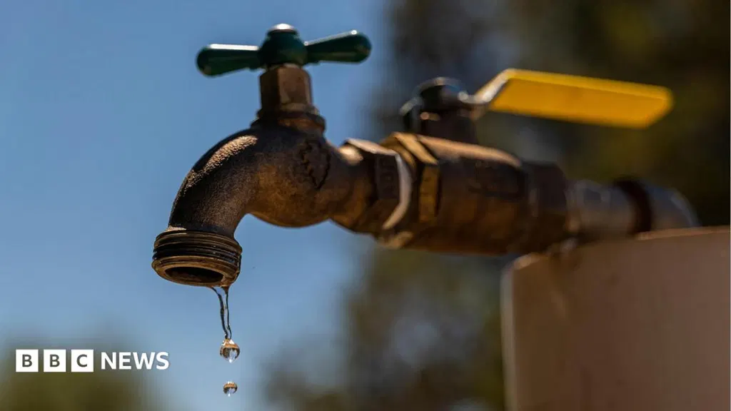 Homes without water and roads closed after burst pipe