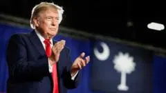 Trump says Canada wants 'benefits' of being US state as Carney says countries in trade war