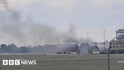 Two dead after small plane crashes into Australia airport hangar