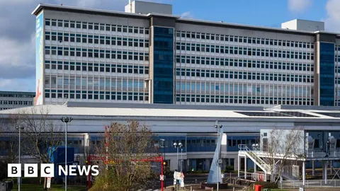 Top surgeon who was blackmailed for drugs after having sex with patient is suspended