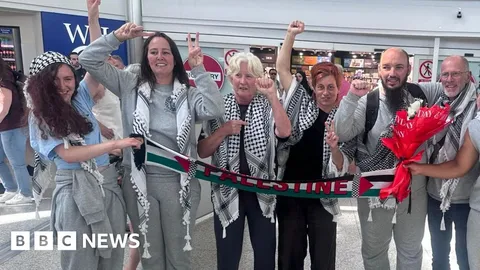 Seven flotilla activists detained in Israel arrive back in UK