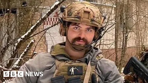 Tributes to 'brave, strong' man killed in Ukraine
