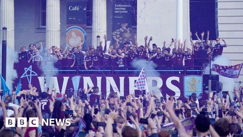 Flares light up Aston Villa's Europa League victory parade