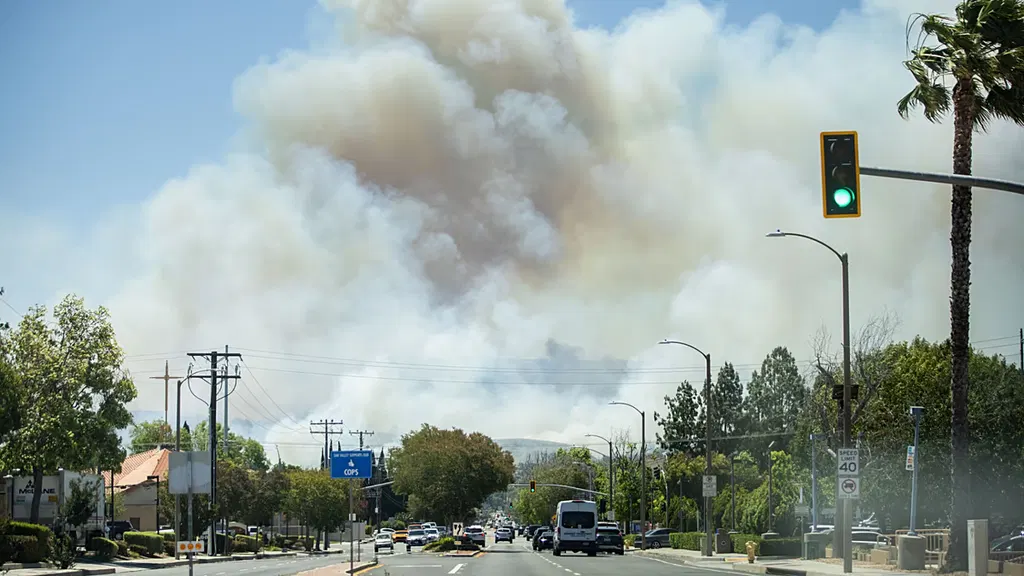 Fast-moving wildfire spreads through Southern California hills