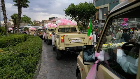 Tehran mass wedding turns military vehicles into bridal cars