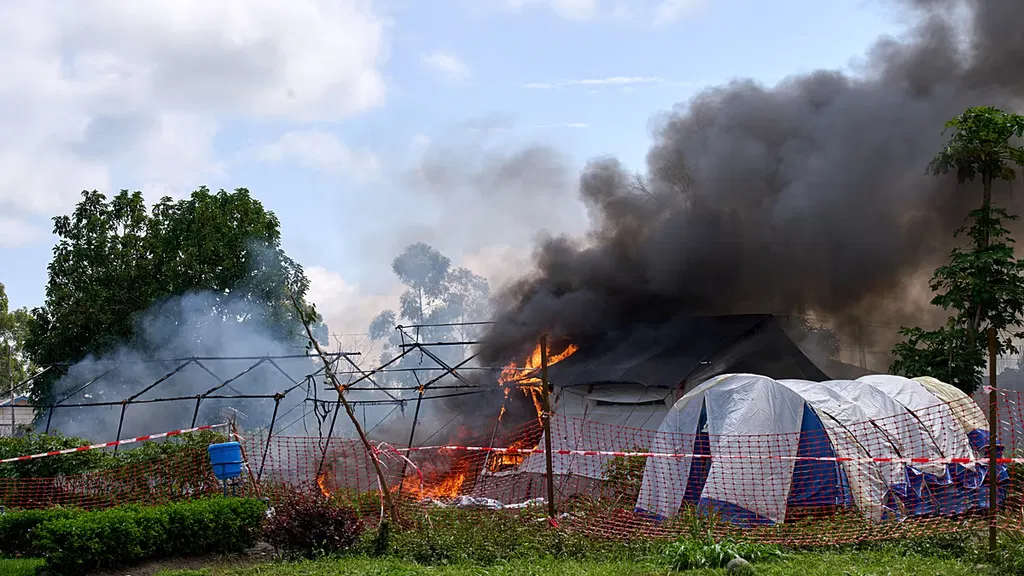 Furious crowd torches Ebola hospital tents in DR Congo