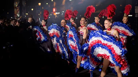 Moulin Rouge dancers welcome Tour de France finale in Paris