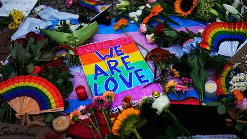 Mourners lay flowers and candles after deadly Berlin Pride attack
