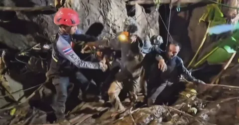 Four still remain trapped in the flooded Laos cave after one person was rescued