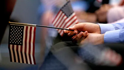 US tells foreigners seeking green cards: Return to your countries to apply