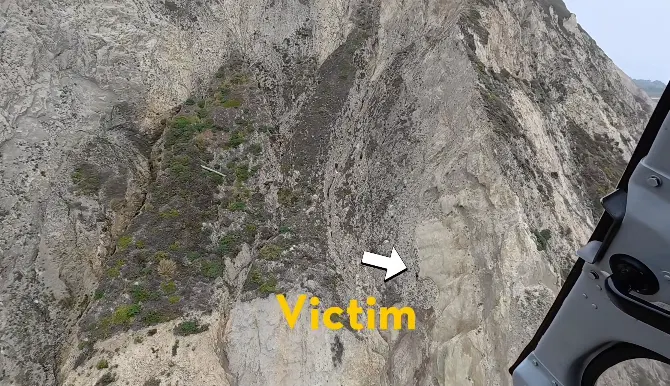 Dramatic moment paraglider who crashed into cliff is pulled to safety in harrowing rescue mission