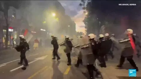 Protesters clash with police after an anti-government rally in Serbia's capital