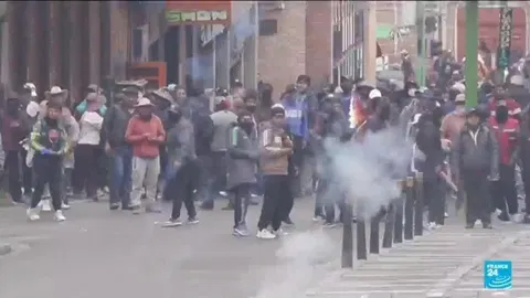 Police, protesters clash in new marches against Bolivian leader