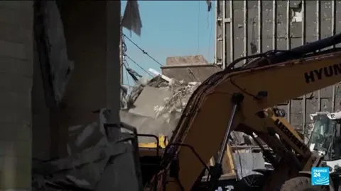 Ukraine vows retribution after Russian strike on housing block kills 24