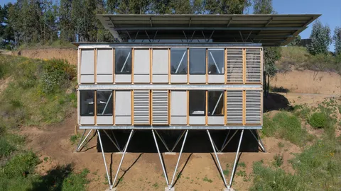 Chilean modular housing protoype uses stilts to traverse difficult site