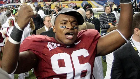 College football national champion who wore wigs in fraud scheme pleads guilty to charges
