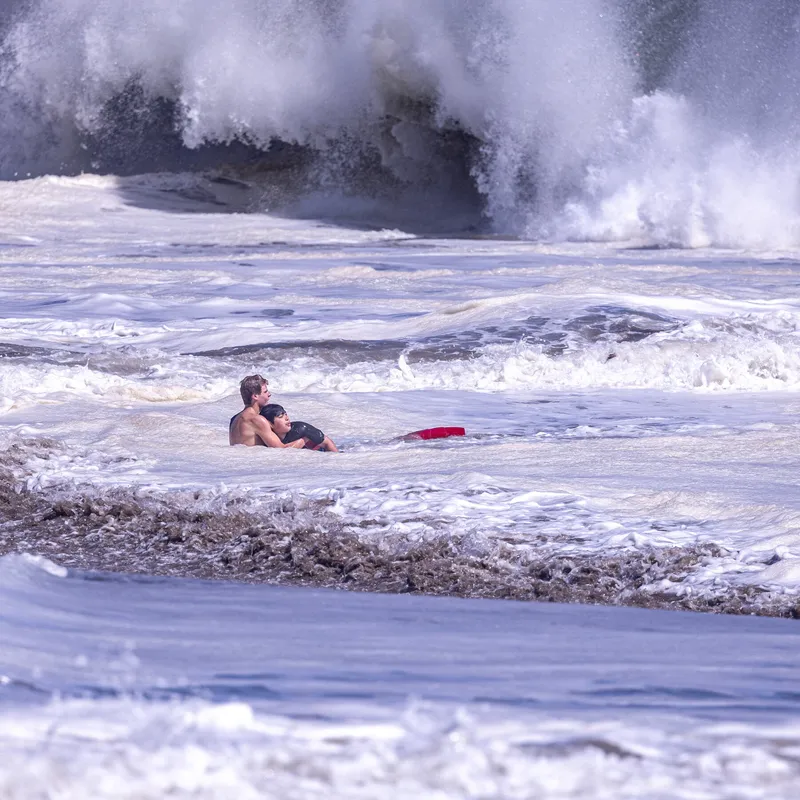 Teenage Lifeguard Fights Intense Waves to Bring Boy to Safety
