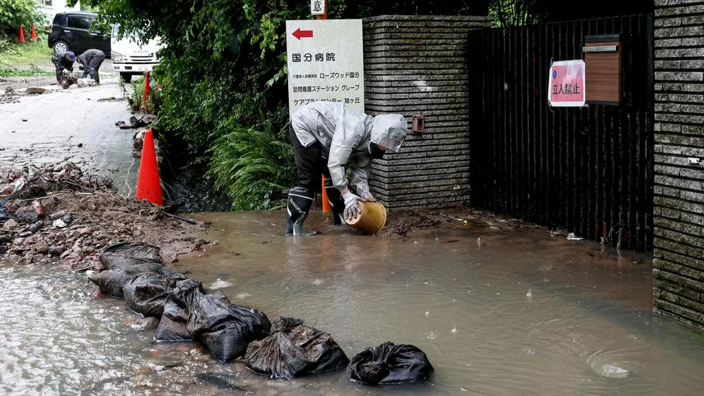 Japan cancels 120 flights as twin storms approach