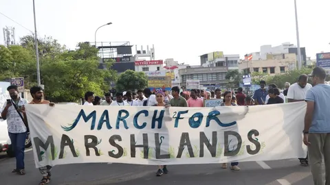City youth march to save marshlands