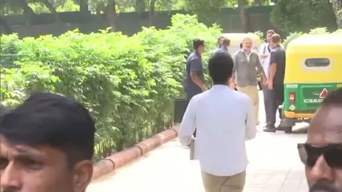 Rahul Gandhi spotted in auto-driver's uniform outside Delhi residence