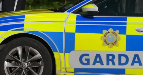 Woman dies and child injured in collision between car and truck