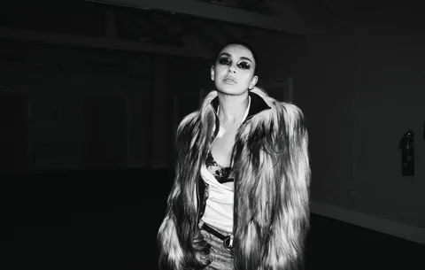 Charli XCX walks Paris runway “straight to hell” on gritty new single ‘SS26’