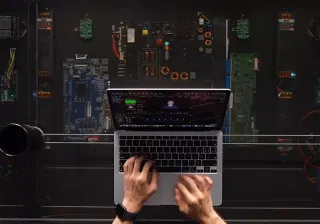This amazing DIY desk uses a camera and a motor to charge your phone wherever you set it down